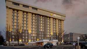A large, multi-story hotel building with a prominent 'LAQUINTA' sign on the facade.