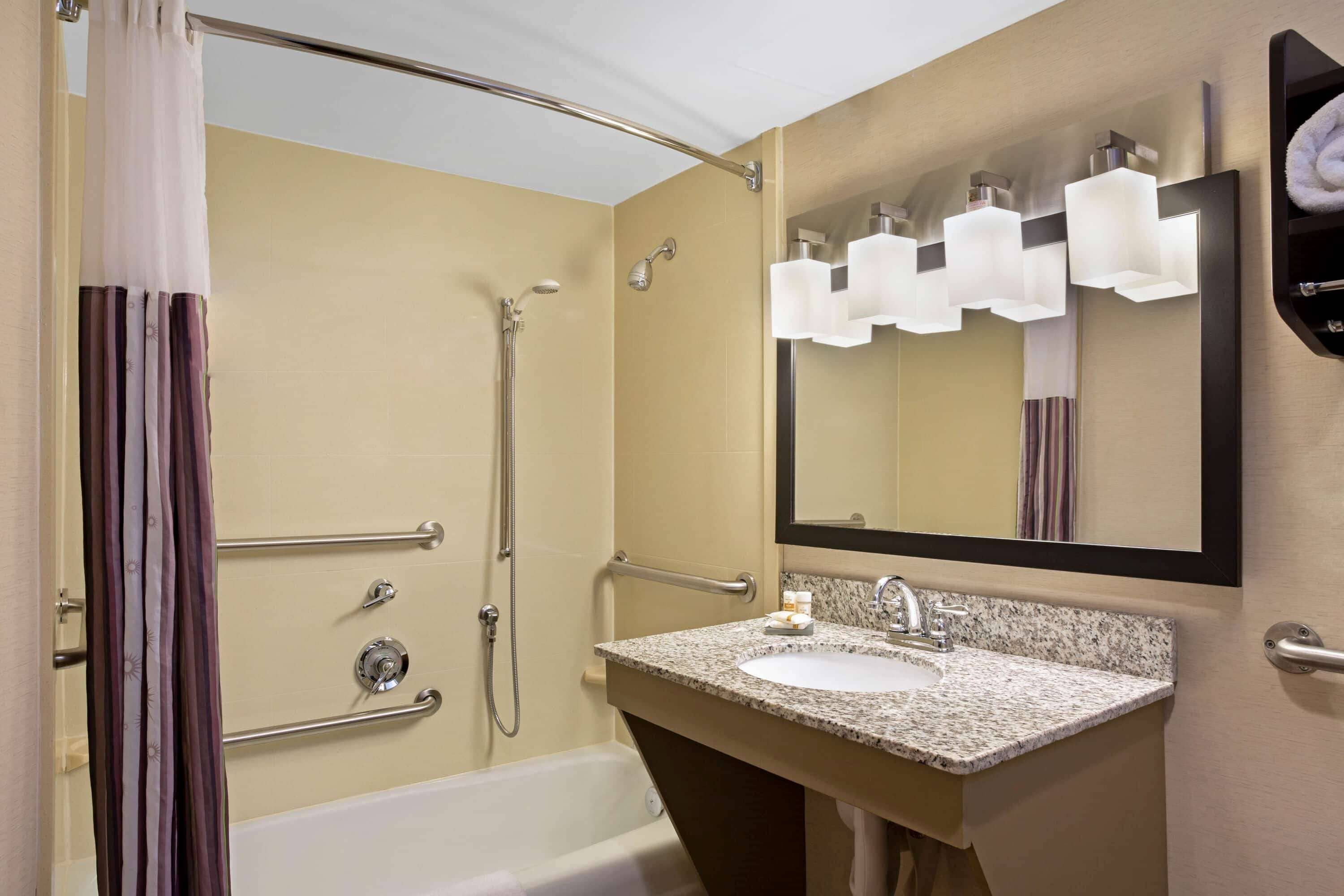 combined shower/bathtub, eco-friendly toiletries, hair dryer, towels