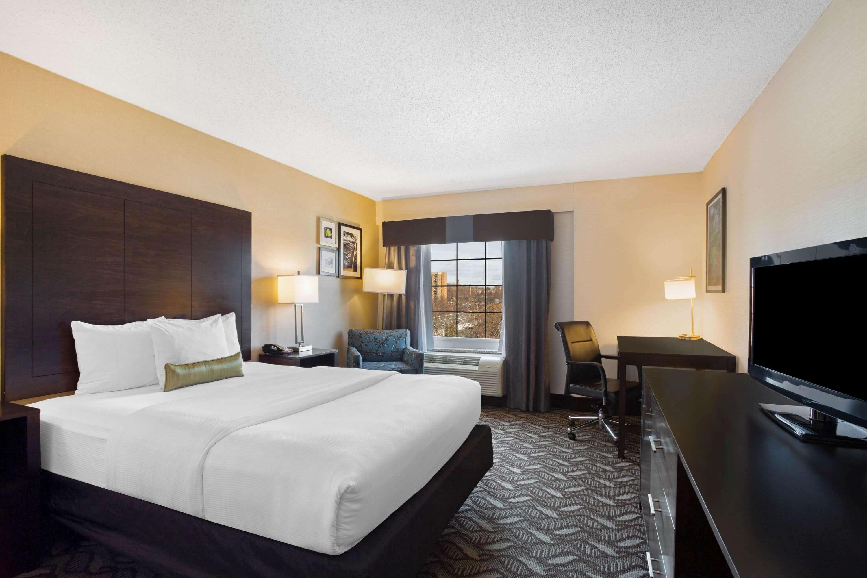 premium bedding, desk, blackout curtains, iron/ironing board