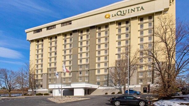 A large, multi-story hotel building with a prominent 'La Quinta' sign.