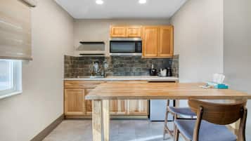Suite, 1 King Bed, Non Smoking, Kitchenette (with Sofabed) | Private kitchenette | Fridge, microwave, coffee/tea maker, dining tables
