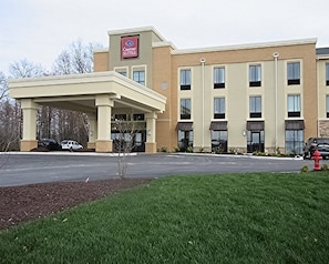 Welcome to Comfort Suites, featuring a modern entrance and well-maintained grounds.