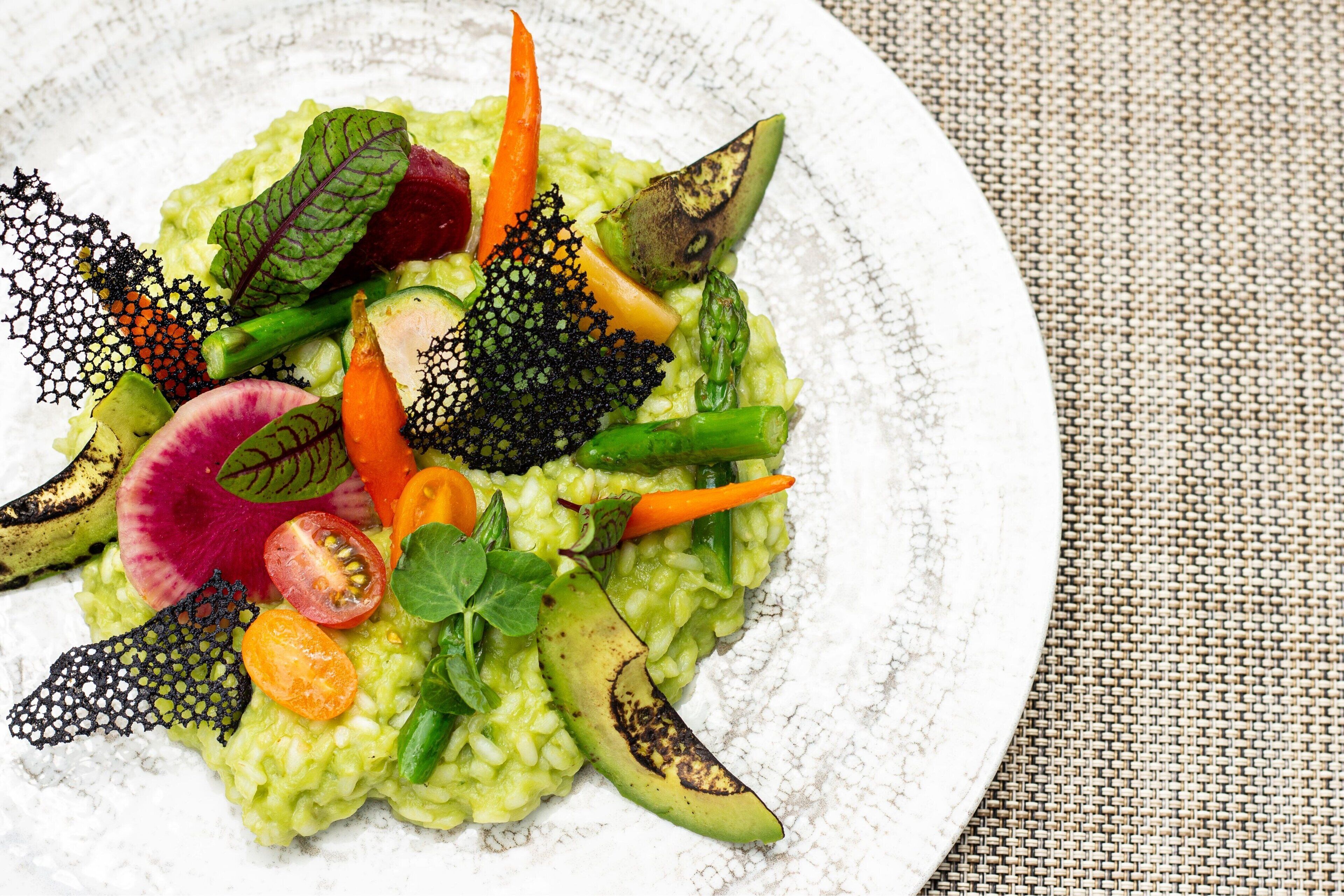 A plate of food with various vegetables and greens.