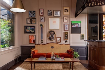 A dining table with a coffee cup and a plate of food. at The Pelham Hotel