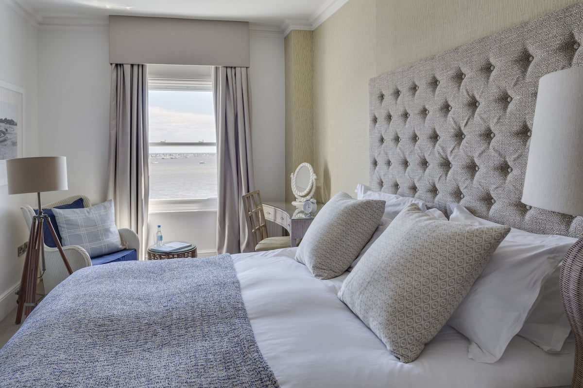 deluxe double room, harbour view | in-room safe, desk, blackout curtains, iron/ironing board