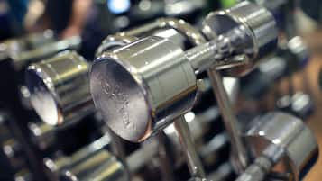 A close-up of a metallic structure with cylindrical components, likely part of a larger mechanical or industrial setup.