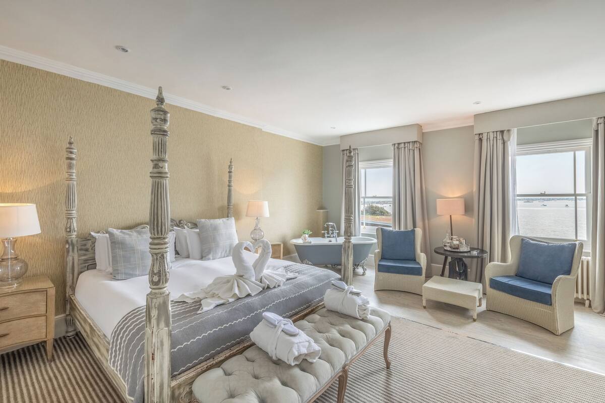 deluxe double room, harbour view | in-room safe, desk, blackout curtains, iron/ironing board