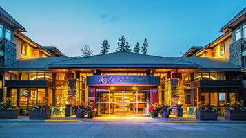 The exterior of the Royal Canadian Lodge with a prominent entrance, large windows, and outdoor seating area.