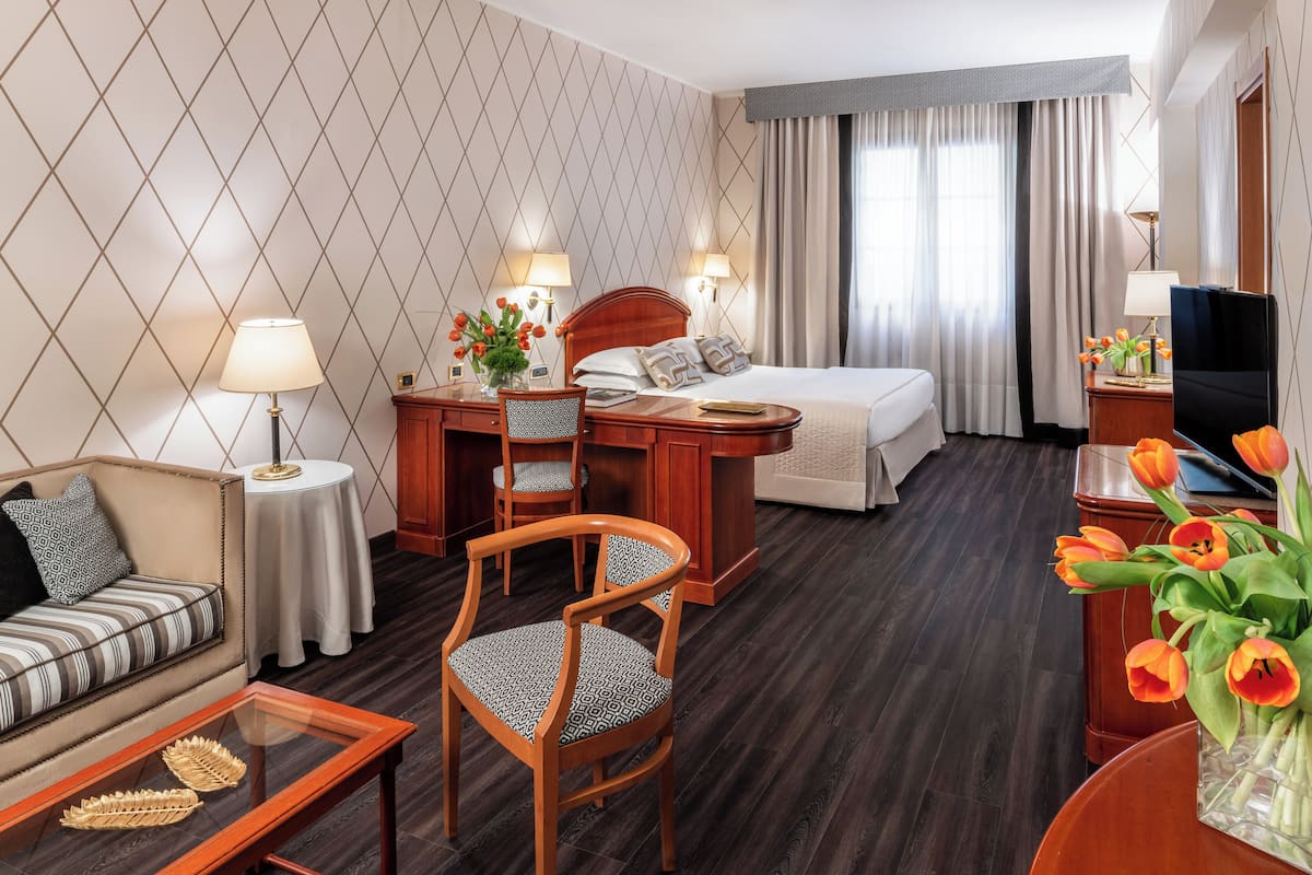 Suite Junior | Biancheria da letto di alta qualità, minibar, una cassaforte in camera