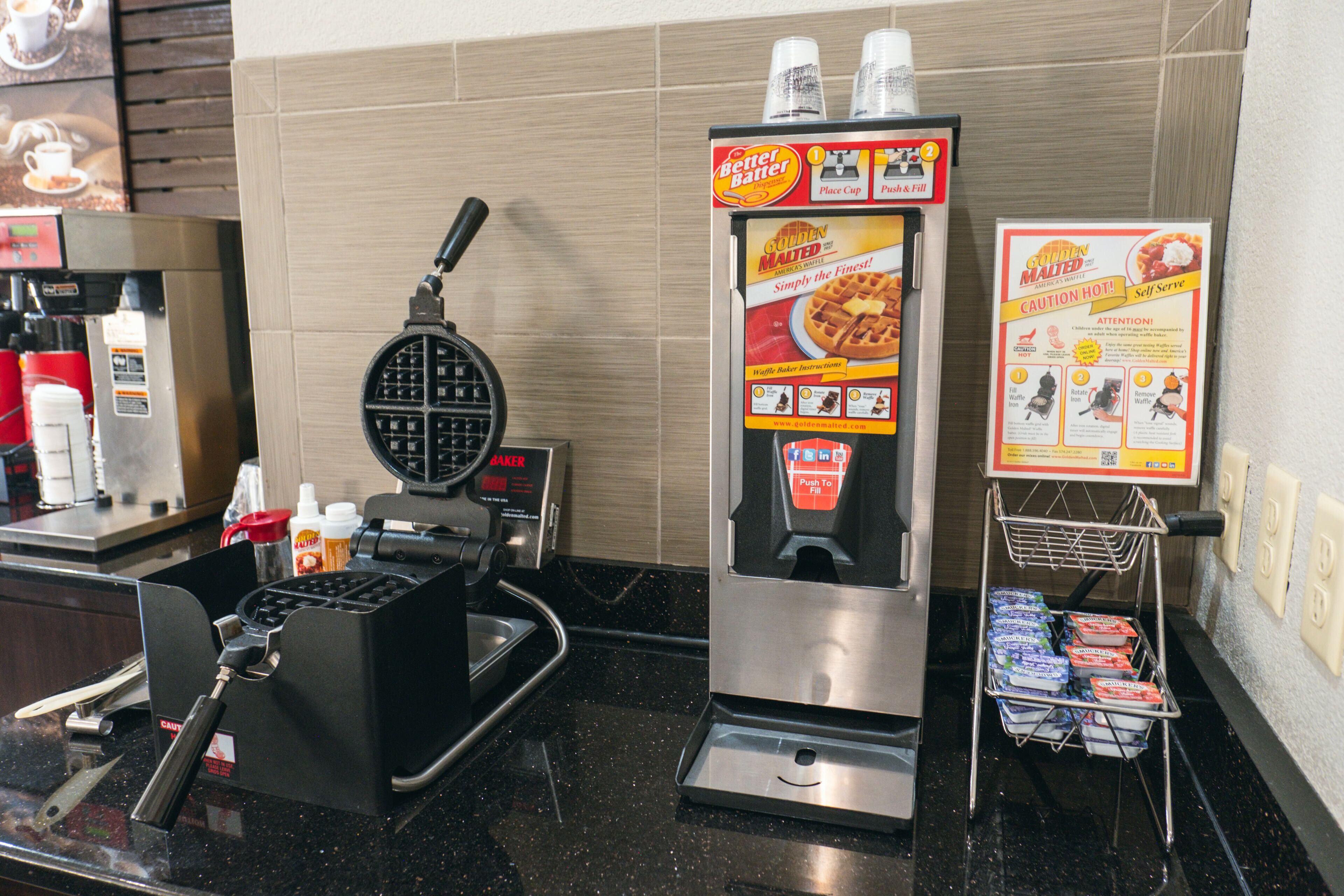 A waffle maker, a waffle maker box, and a self-serve waffle station.