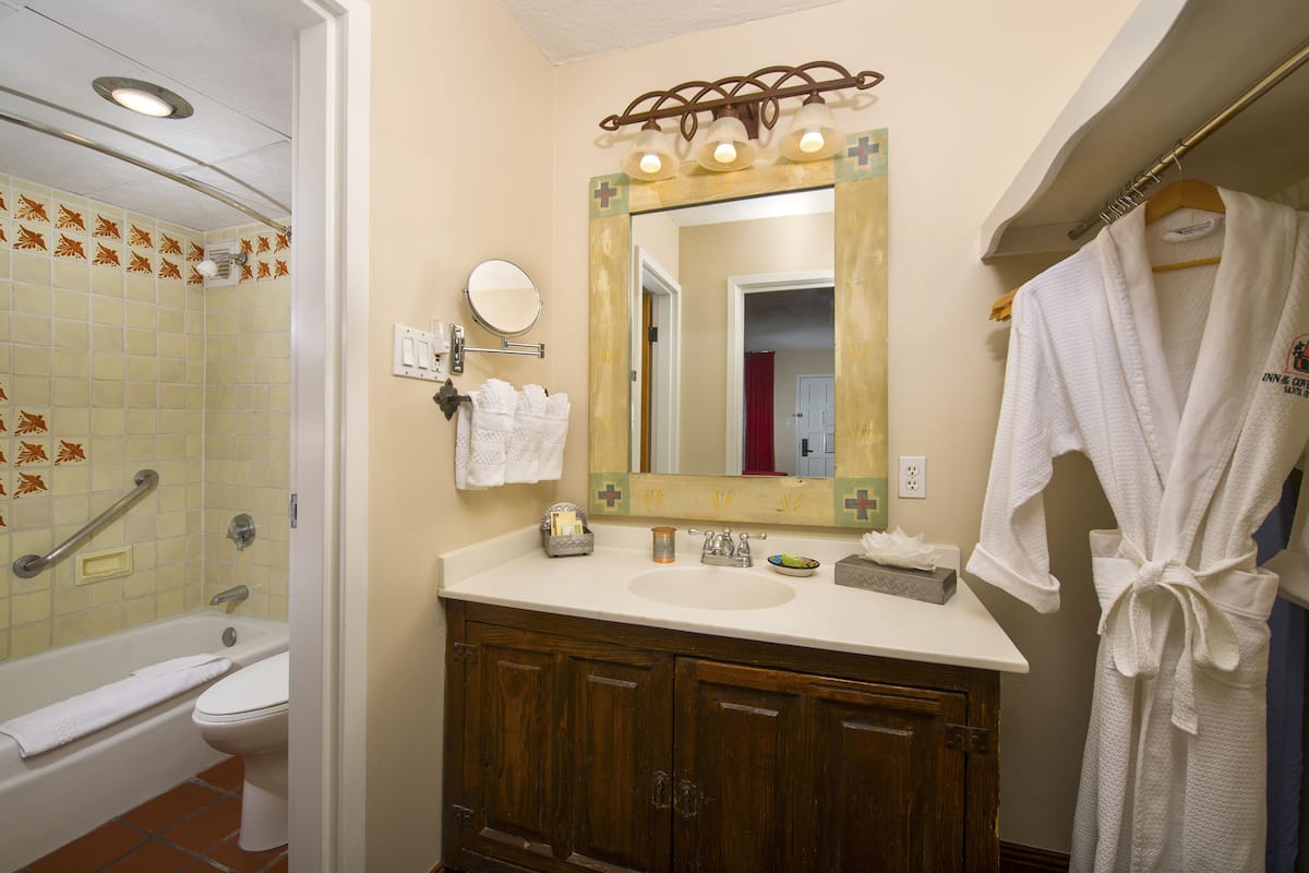 combined shower/bathtub, designer toiletries, hair dryer, bathrobes