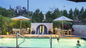Outdoor pool, a heated pool, pool loungers