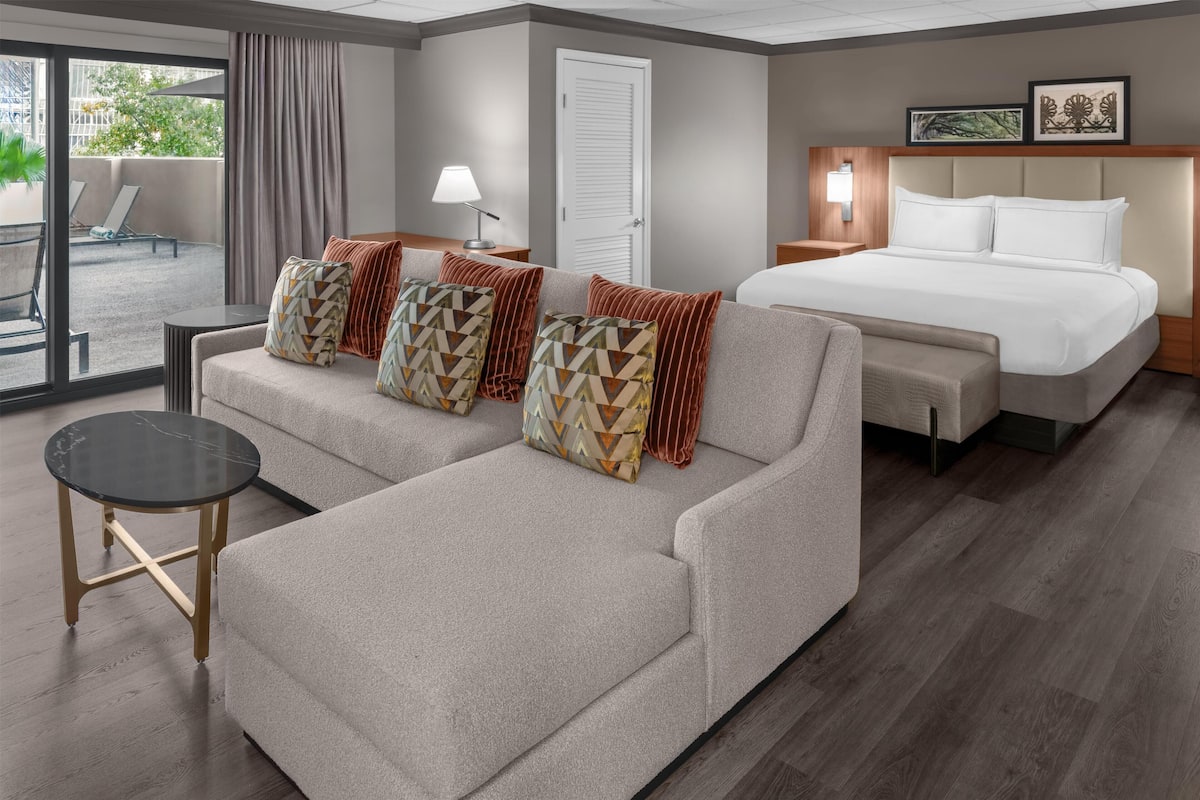 Junior Single Room, 1 King Bed | Living area | 45-inch flat-screen TV with satellite channels, TV