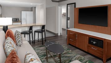 Suite, 2 Queen Beds | Living area | 45-inch flat-screen TV with satellite channels, TV