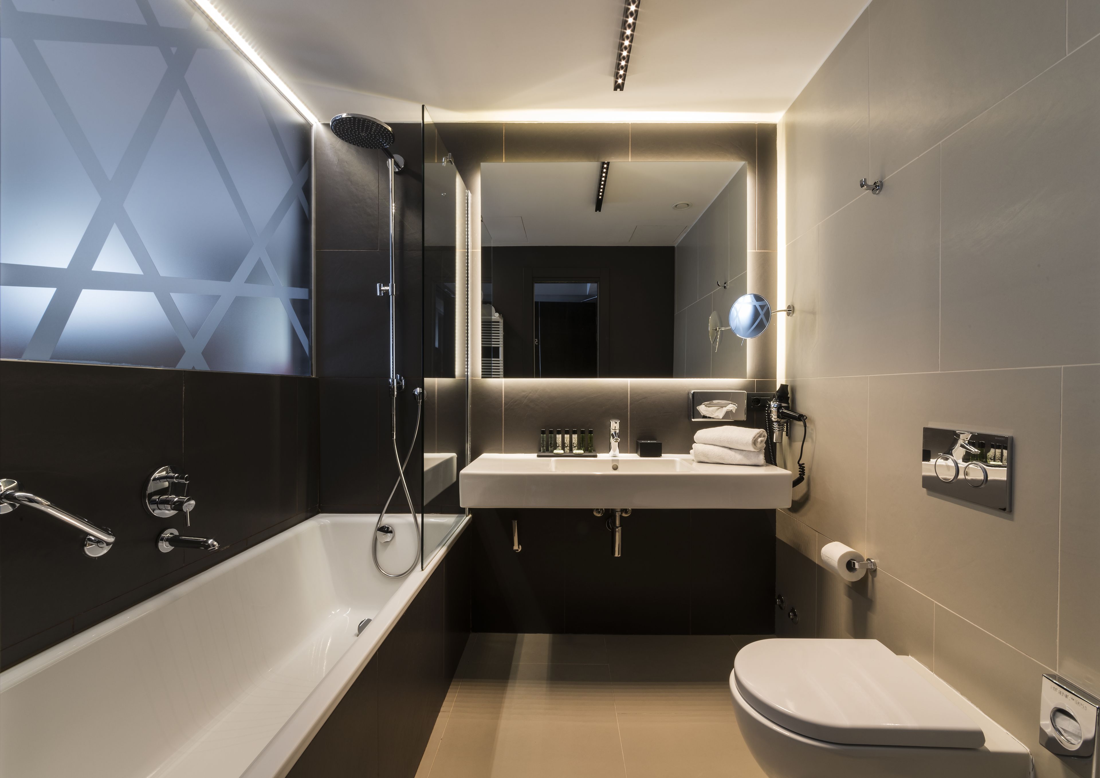 junior suite, 1 king bed with sofa bed | bathroom | designer toiletries, hair dryer, slippers, bidet