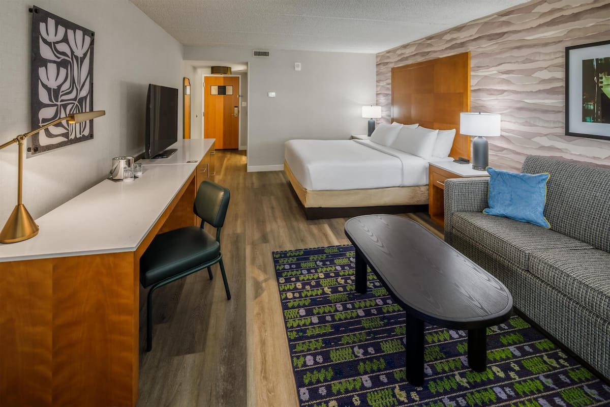 Room, 1 King Bed with Sofa bed (with Shower) | Living area | 32-inch LCD TV with cable channels, TV, MP3 dock