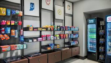 A vending area with snacks, drinks, and a life water cooler.