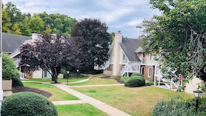 A residential neighborhood with houses, well-maintained lawns, and a clear pathway. - Residence Inn by Marriott Hartford/Windsor (Windsor)