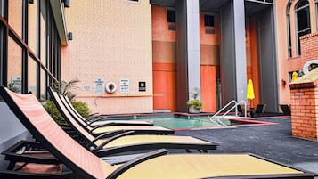 Indoor pool, a heated pool, open 10:00 AM to 10:00 PM, sun loungers