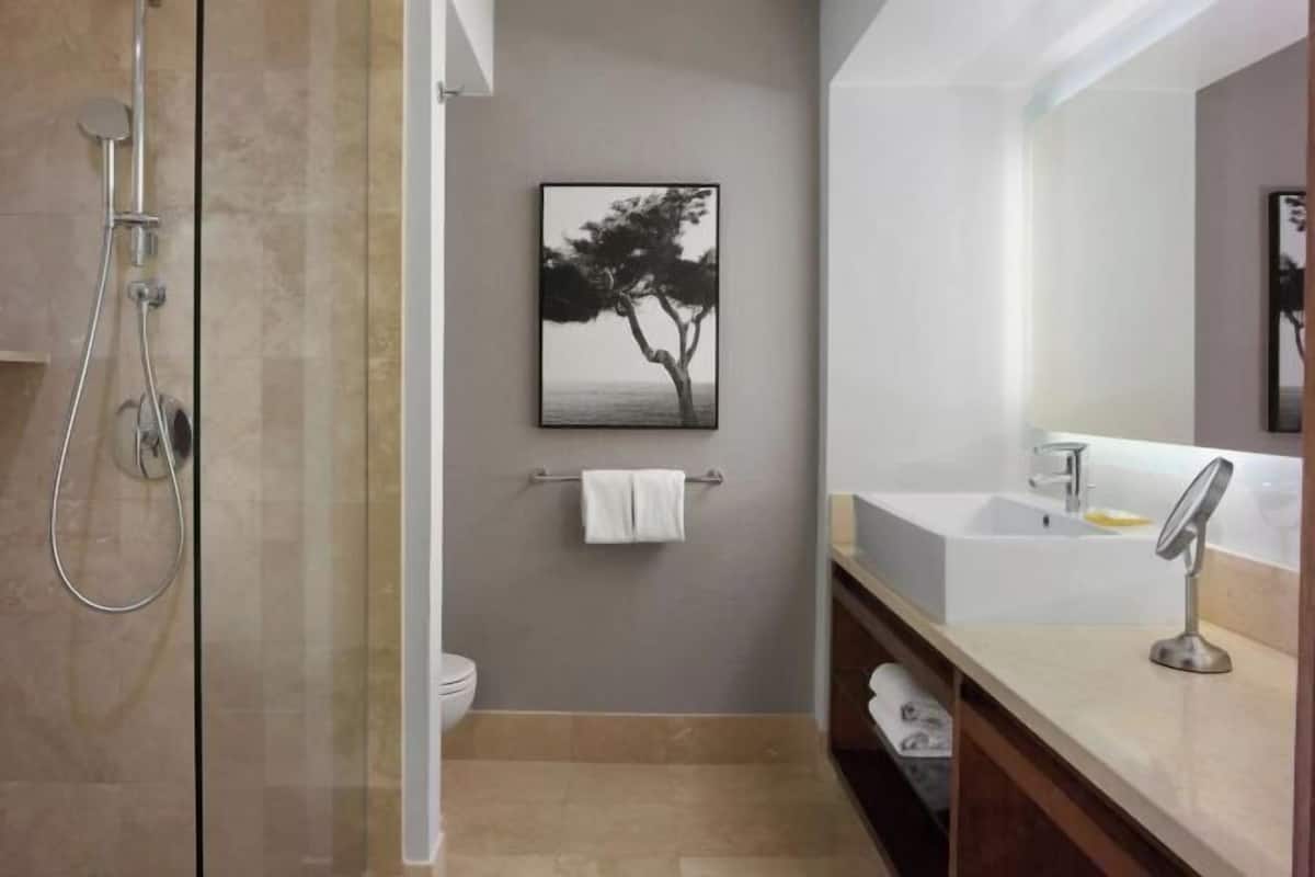 Designer toiletries, hair dryer, bathrobes, slippers