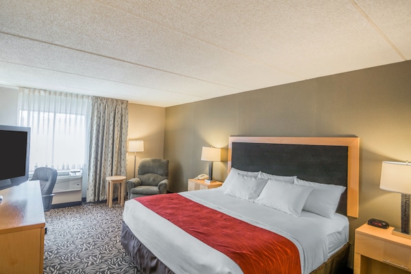 Premium bedding, desk, laptop workspace, blackout drapes
