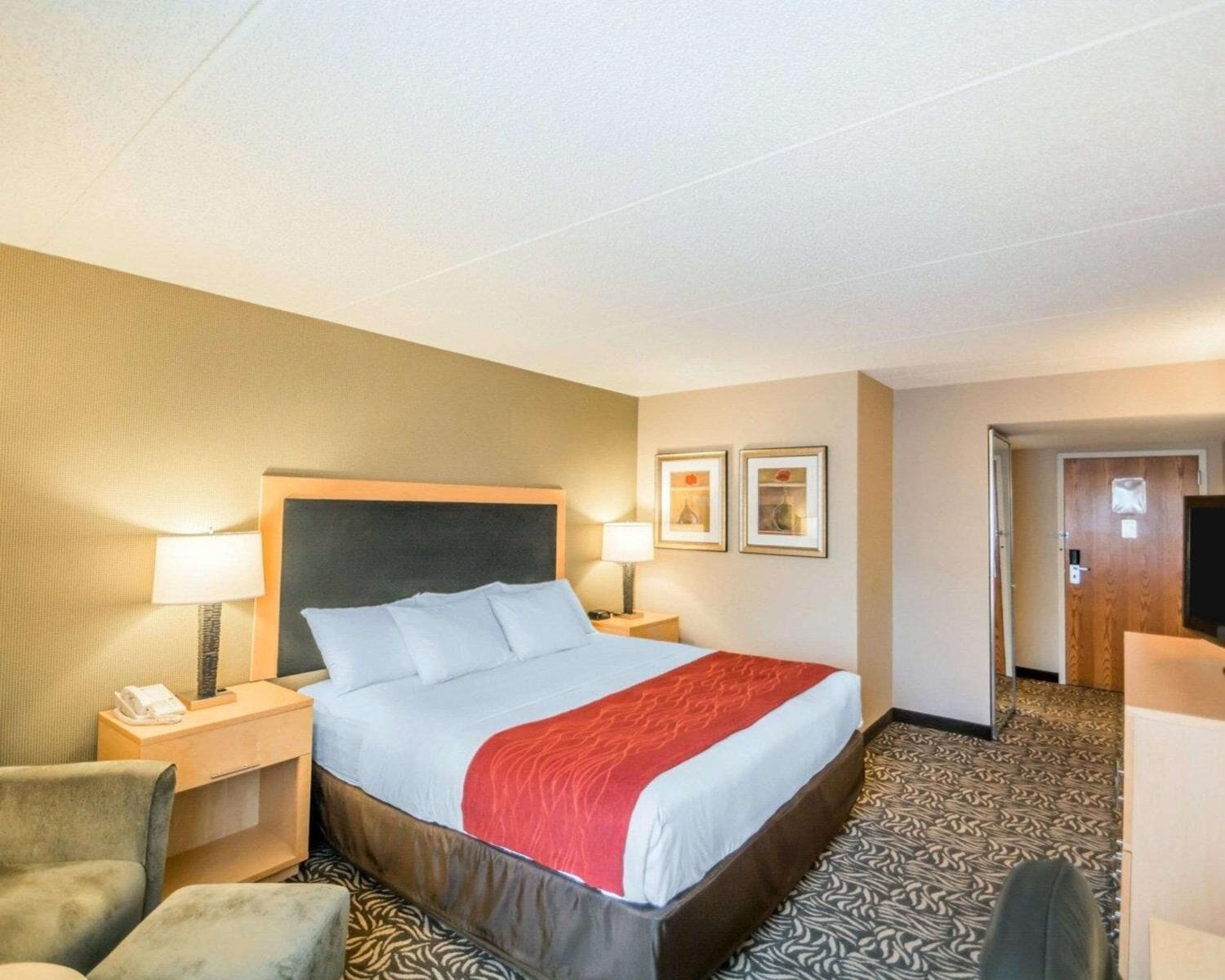 Premium bedding, desk, laptop workspace, blackout drapes