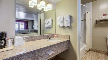 Suite, 1 King Bed, Non Smoking | Bathroom | Bathtub, free toiletries, hair dryer, towels
