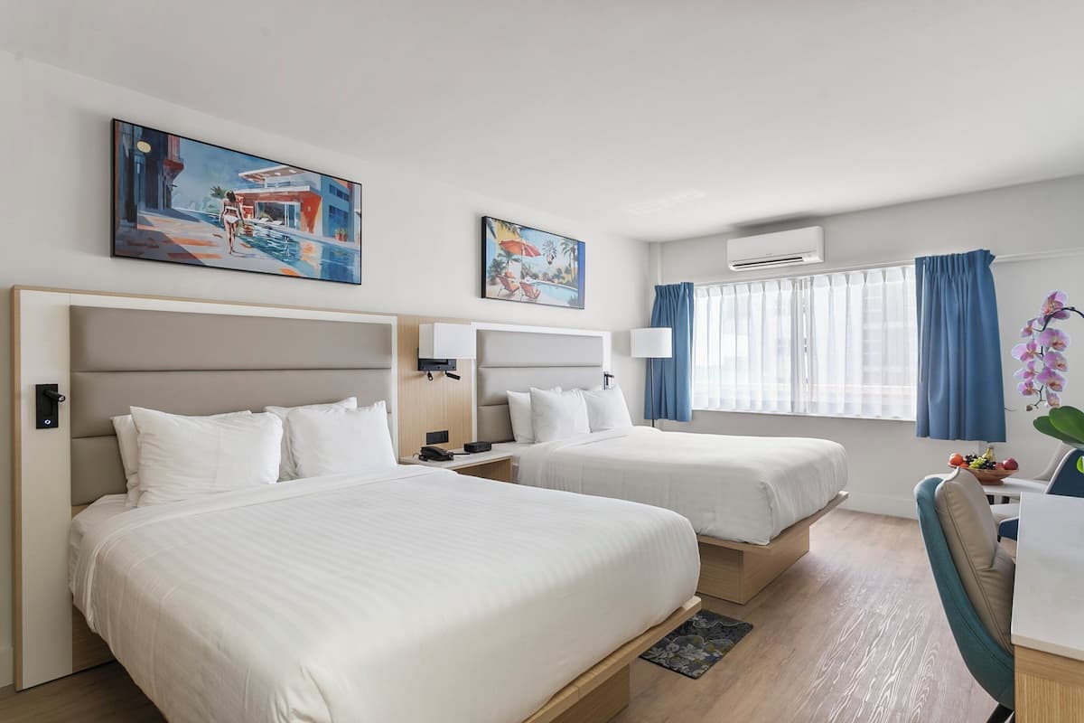 Deluxe Room, 2 Double Beds, Partial Ocean View | 1 bedroom, in-room safe, blackout drapes, iron/ironing board