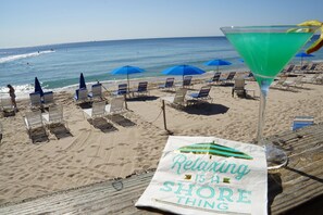On the beach, beach cabanas, sun-loungers, beach umbrellas
