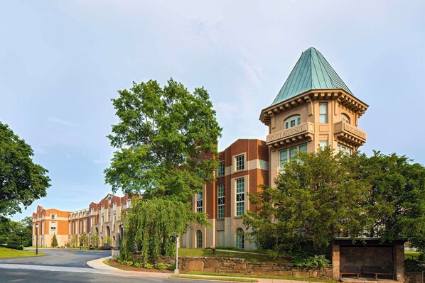 A large, historic building with a prominent tower and multiple windows. - Hyatt Regency Greenwich (Old Greenwich)
