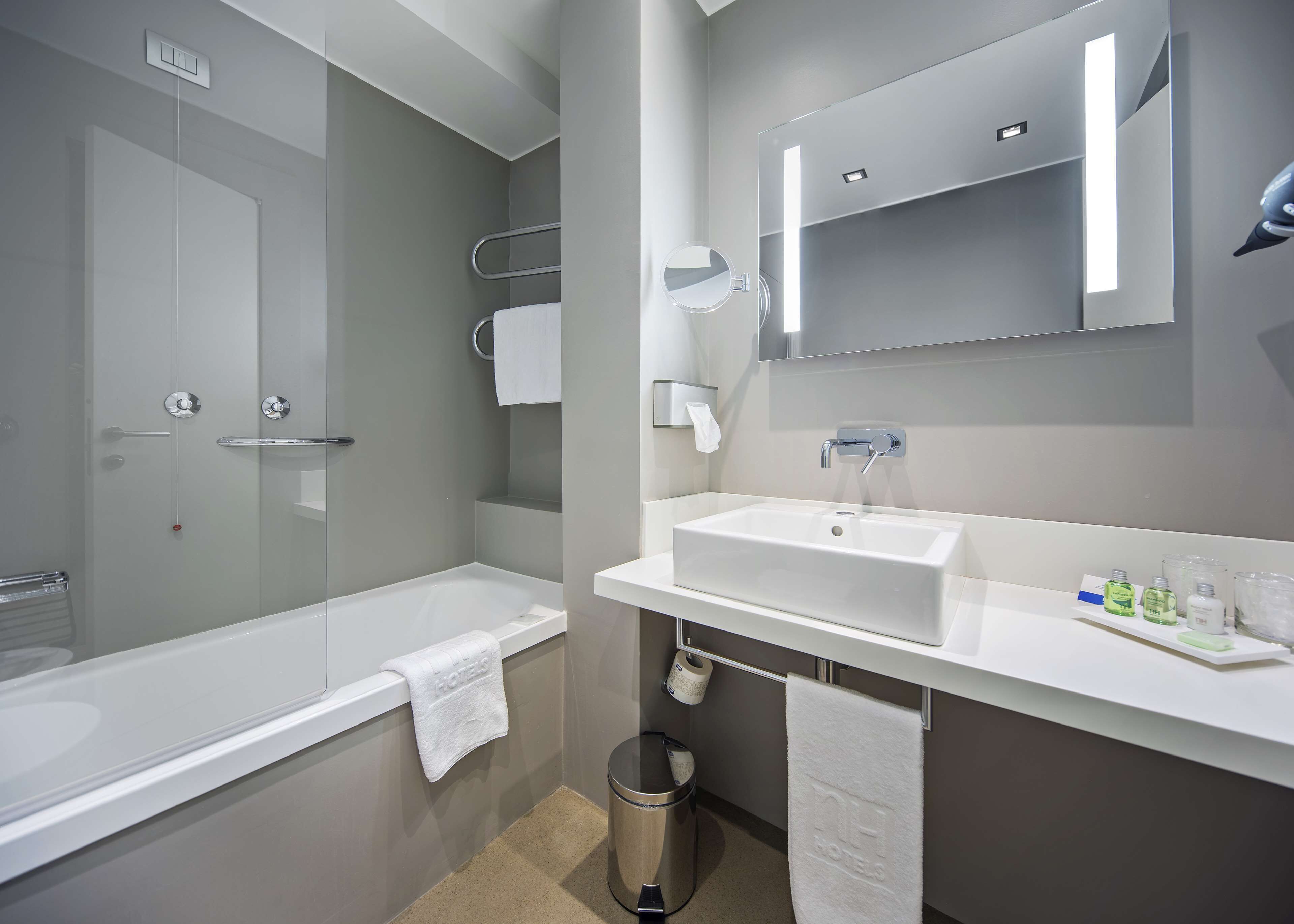 deep-soaking bathtub, eco-friendly toiletries, hair dryer, bidet