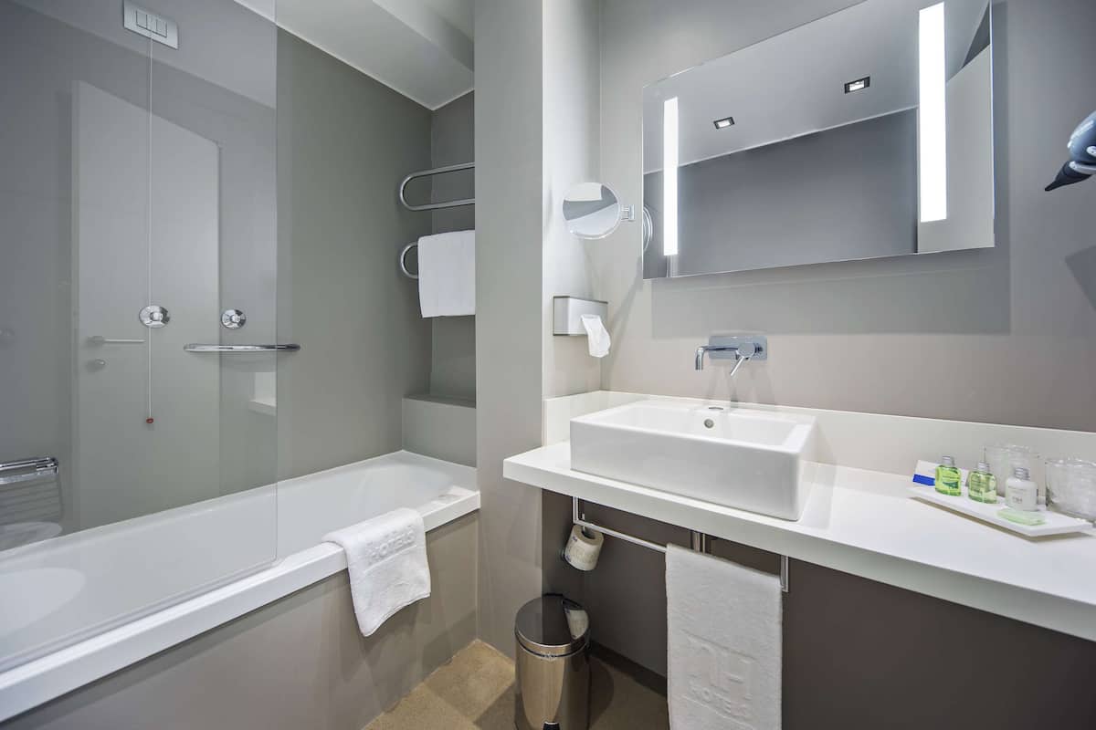 deep-soaking bathtub, eco-friendly toiletries, hair dryer, bidet