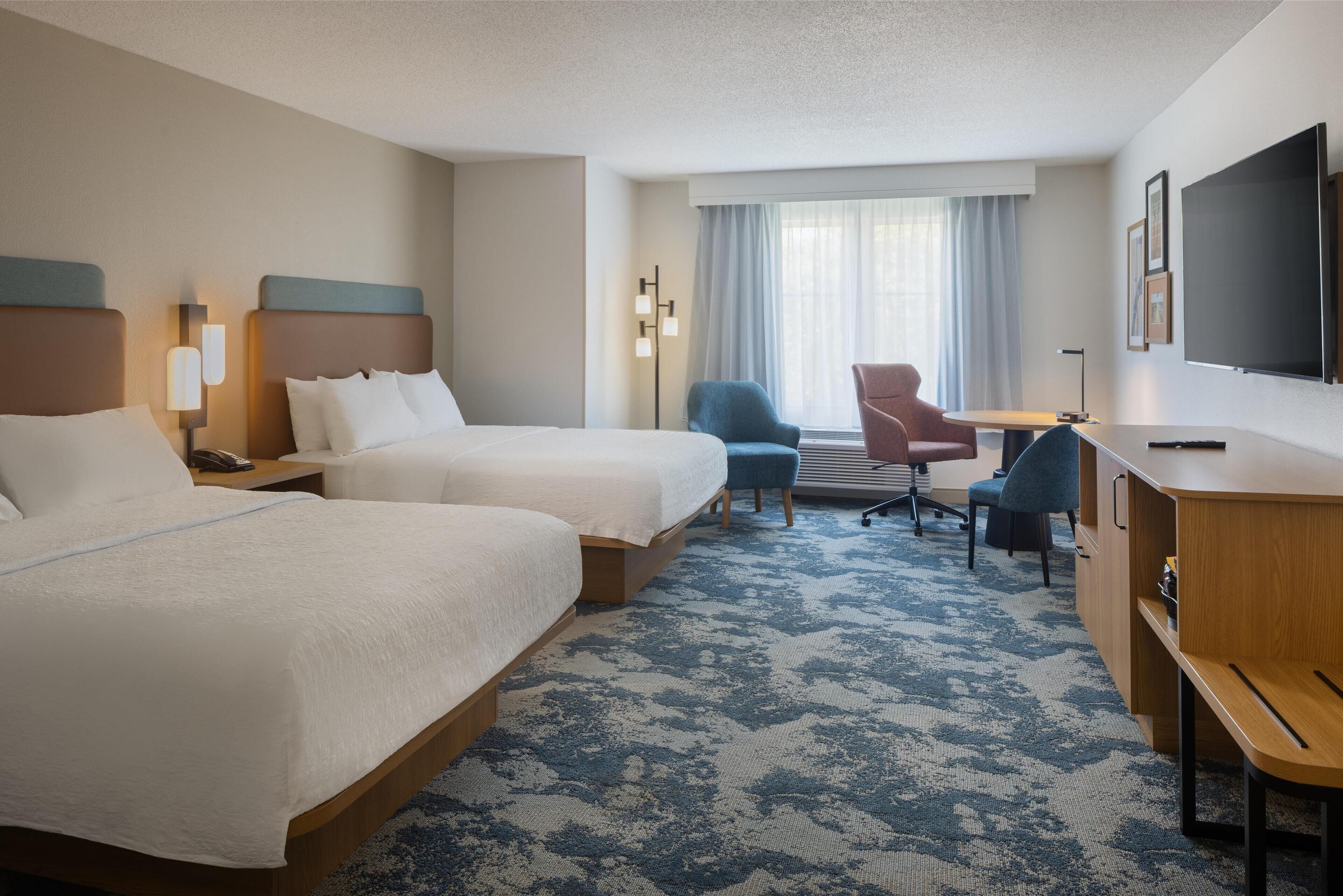 room, 2 queen beds | in-room safe, desk, iron/ironing board, free cots/infant beds