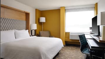 Premium bedding, desk, laptop workspace, blackout curtains