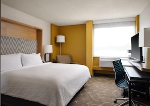 Premium bedding, desk, laptop workspace, blackout curtains