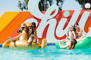 Outdoor pool, a heated pool, open 9:00 AM to 9:00 PM, pool loungers