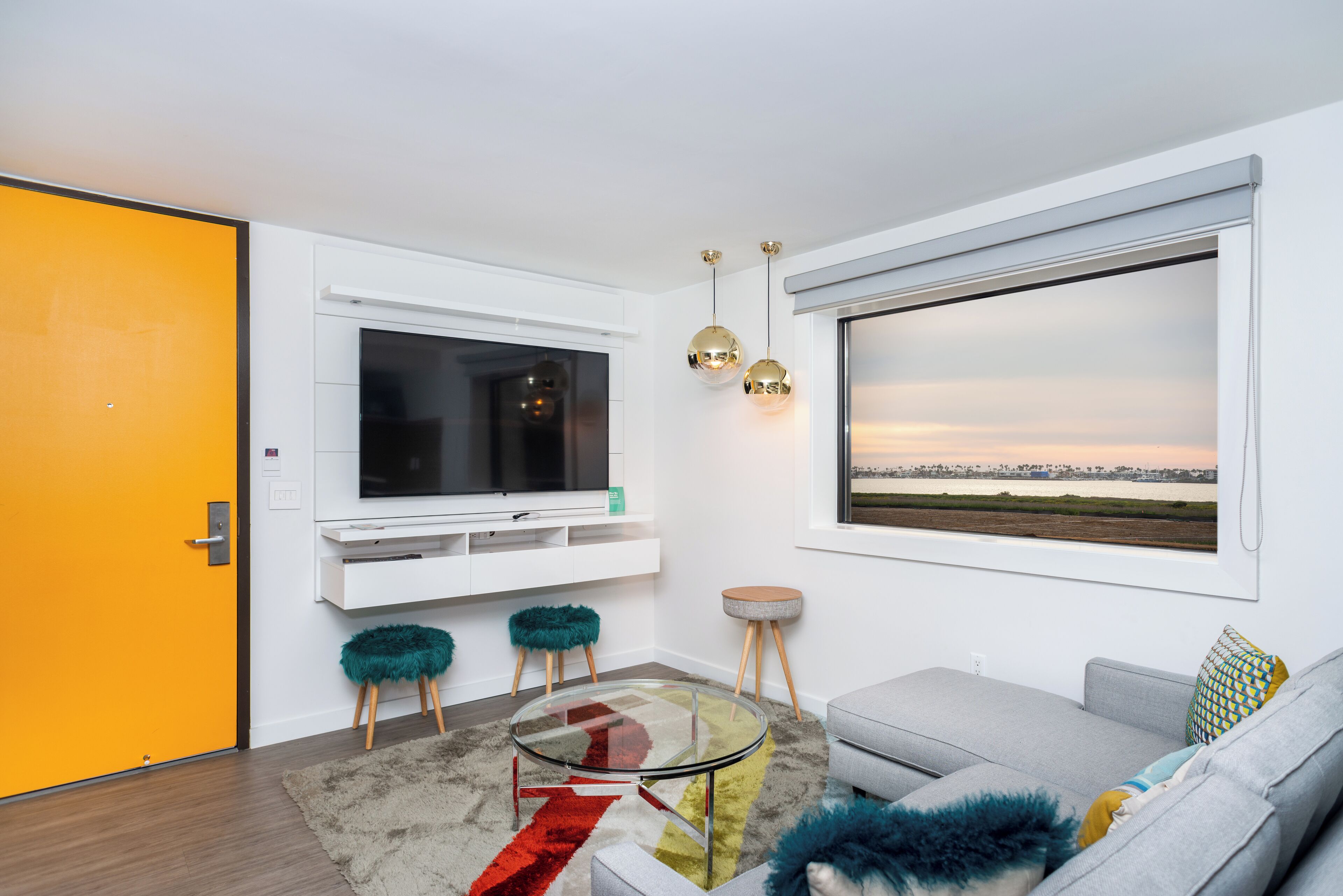 Bay View King Suite | Living area | 50-inch flat-screen TV with satellite channels, TV