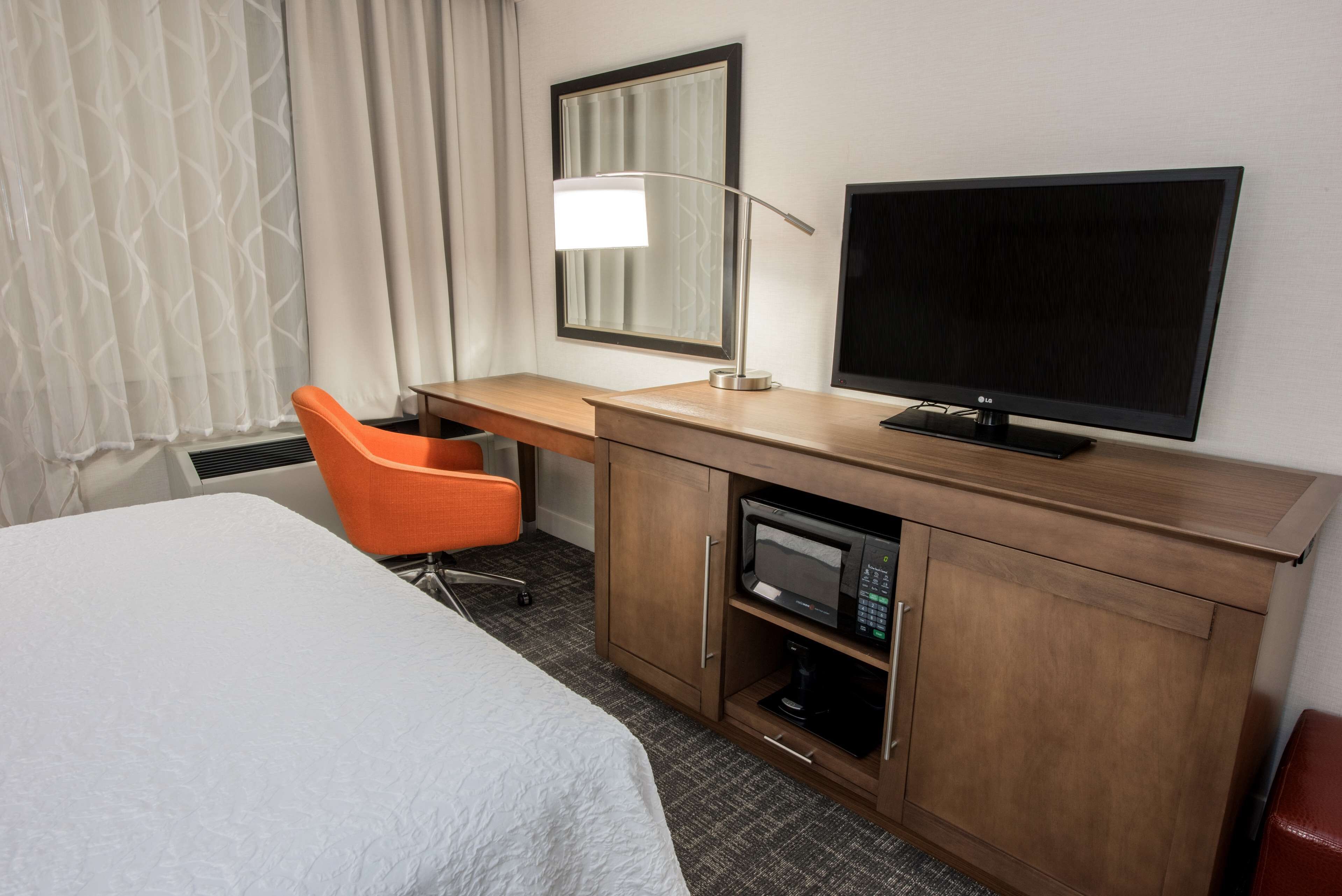 room, 2 queen beds, refrigerator & microwave | in-room safe, desk, laptop workspace, blackout curtains