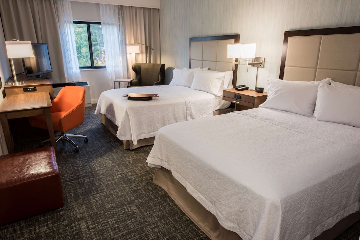 room, 2 queen beds, refrigerator & microwave | in-room safe, desk, laptop workspace, blackout curtains