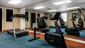 A gym with treadmills, stationary bikes, and a rowing machine. - Quality Inn & Suites Binghamton Vestal (Binghamton)