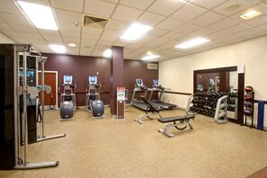 A gym with treadmills, elliptical machines, and free weights. - DoubleTree by Hilton Dallas - Richardson (Richardson)