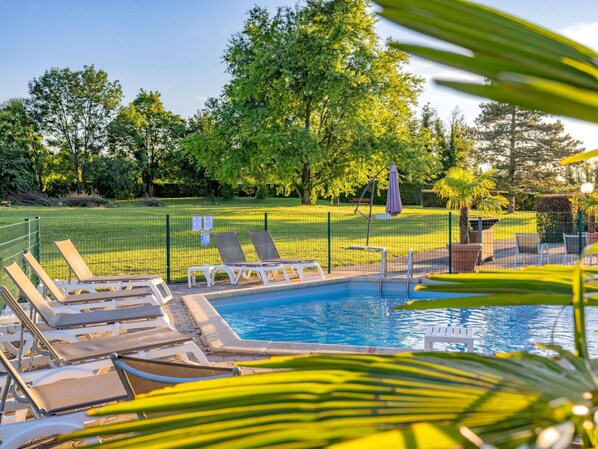 Indoor pool, outdoor pool, open 7:00 AM to 9:30 PM, pool loungers