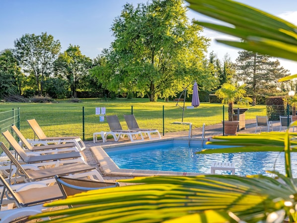 Indoor pool, outdoor pool, open 7:00 AM to 9:30 PM, pool loungers