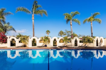 Outdoor pool, sun loungers at Bahia Resort Hotel