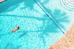 Outdoor pool, open 8:00 AM to 7:00 PM, cabanas (surcharge)