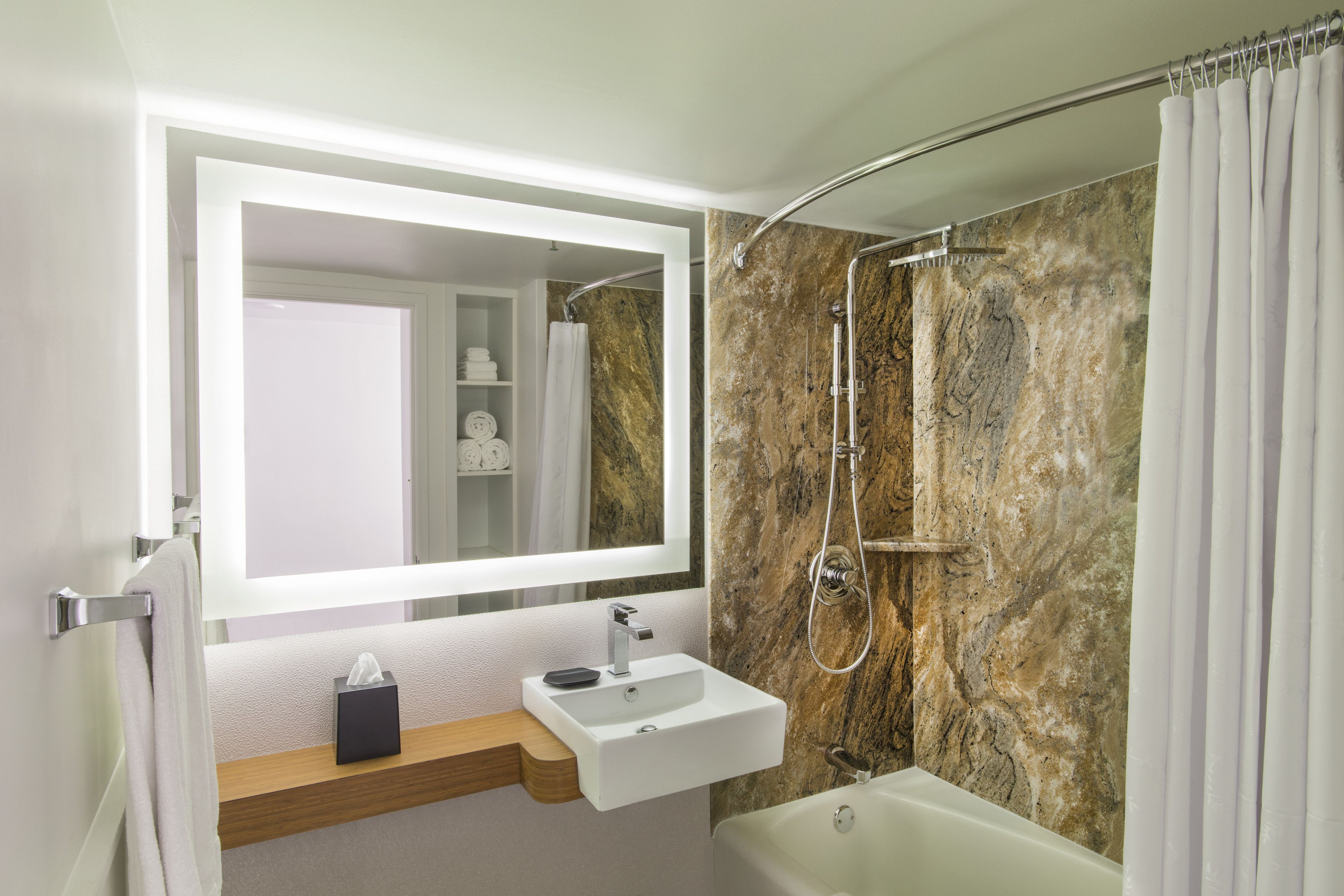 combined shower/bathtub, rainfall showerhead, designer toiletries