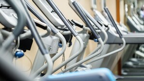 A row of stationary exercise bikes in a gym. - Hotel Captain Cook (Anchorage)