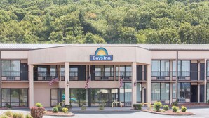 A Days Inn building with a flat roof, large windows, and a sign above the entrance. - Days Inn by Wyndham Princeton (Princeton)