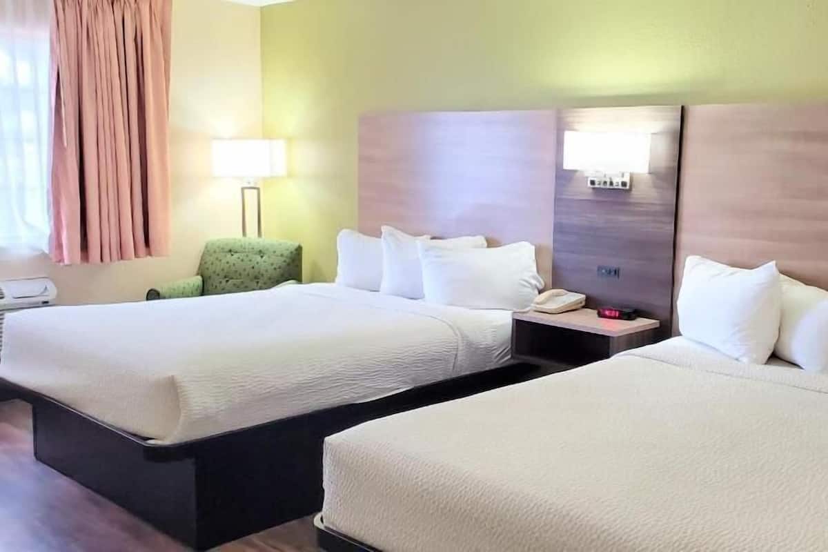 Premium bedding, desk, iron/ironing board, free cribs/infant beds