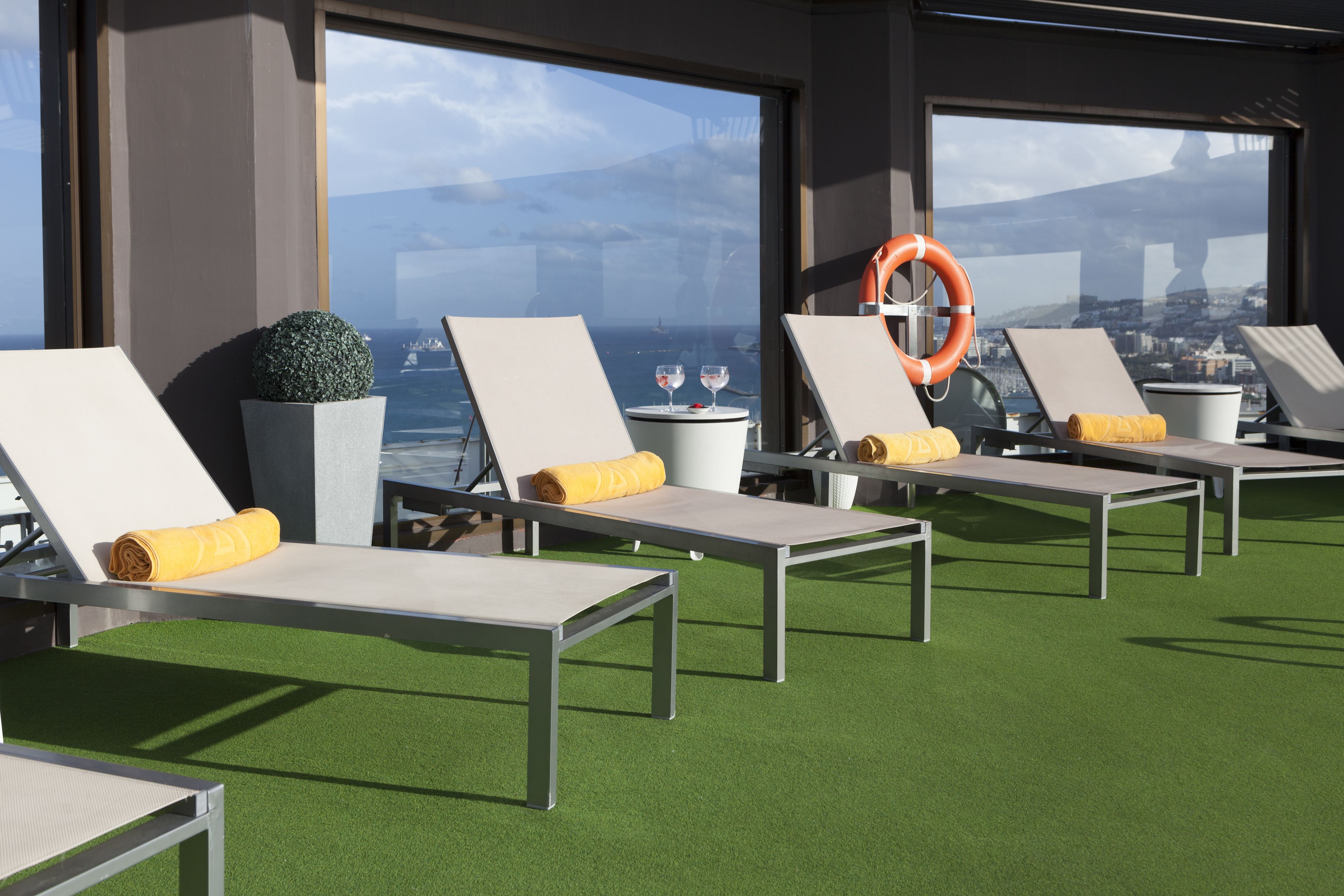 outdoor pool, open 11:00 am to 7:00 pm, pool umbrellas, pool loungers